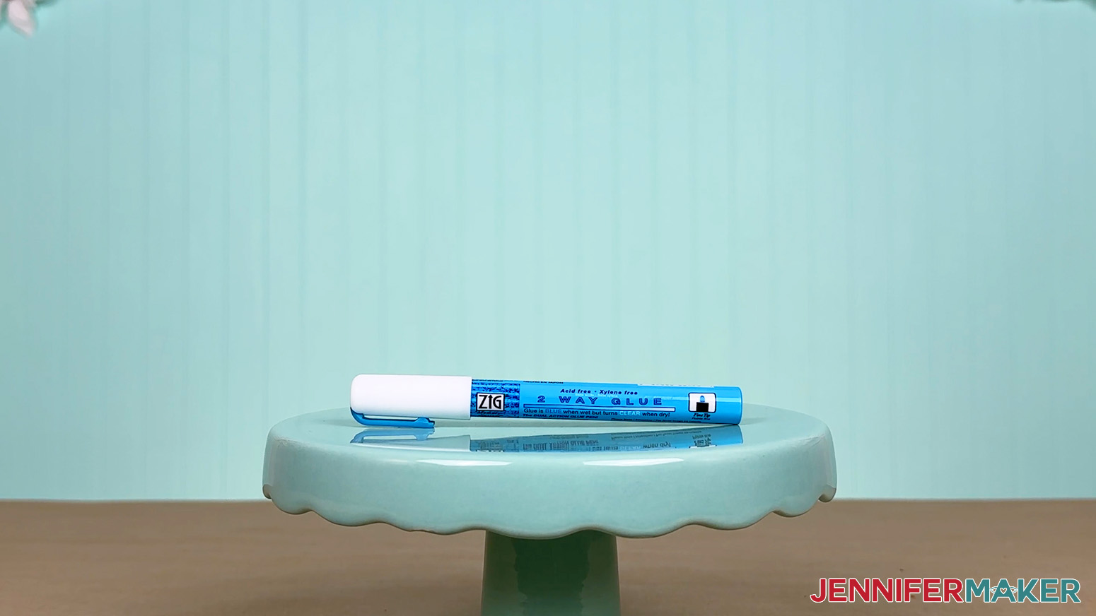 The 2mm Zig 2 Way Glue pen is arranged on a display table for the Best Craft Glues test.