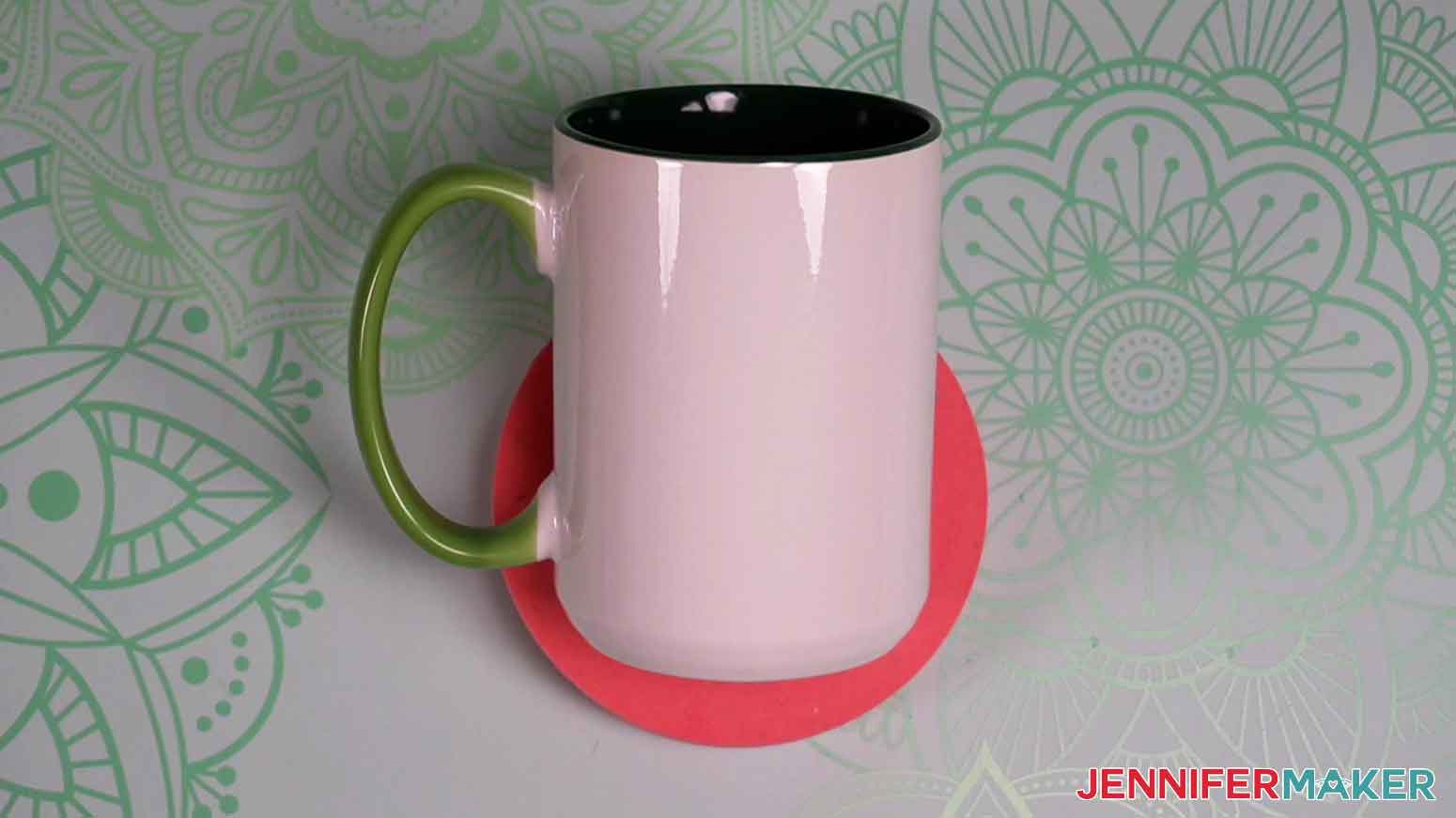 Use a roll of painter's tape to stabilize the mug for vinyl placement.