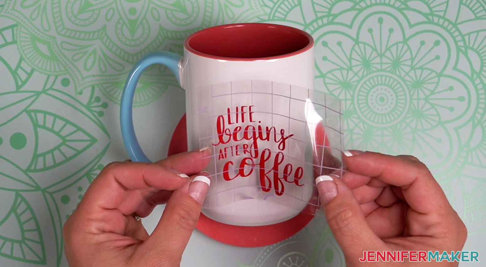 Fold up the edges of the strong grip transfer tape to apple the red shimmer vinyl on the ceramic Cricut coffee mug.