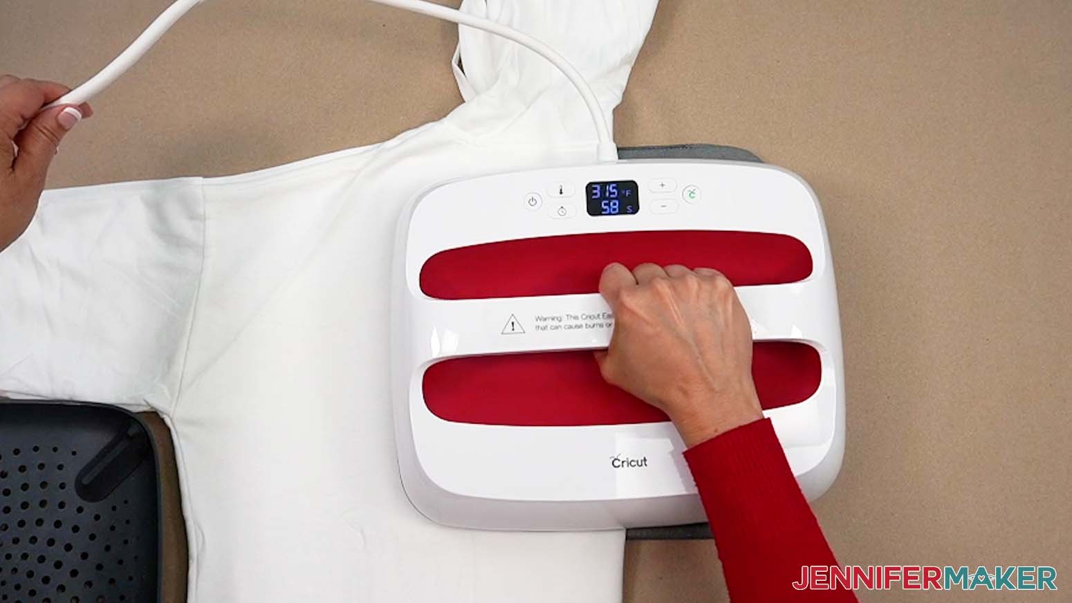Press to preheat and crease the center line of the shirt before applying the big HTV design.