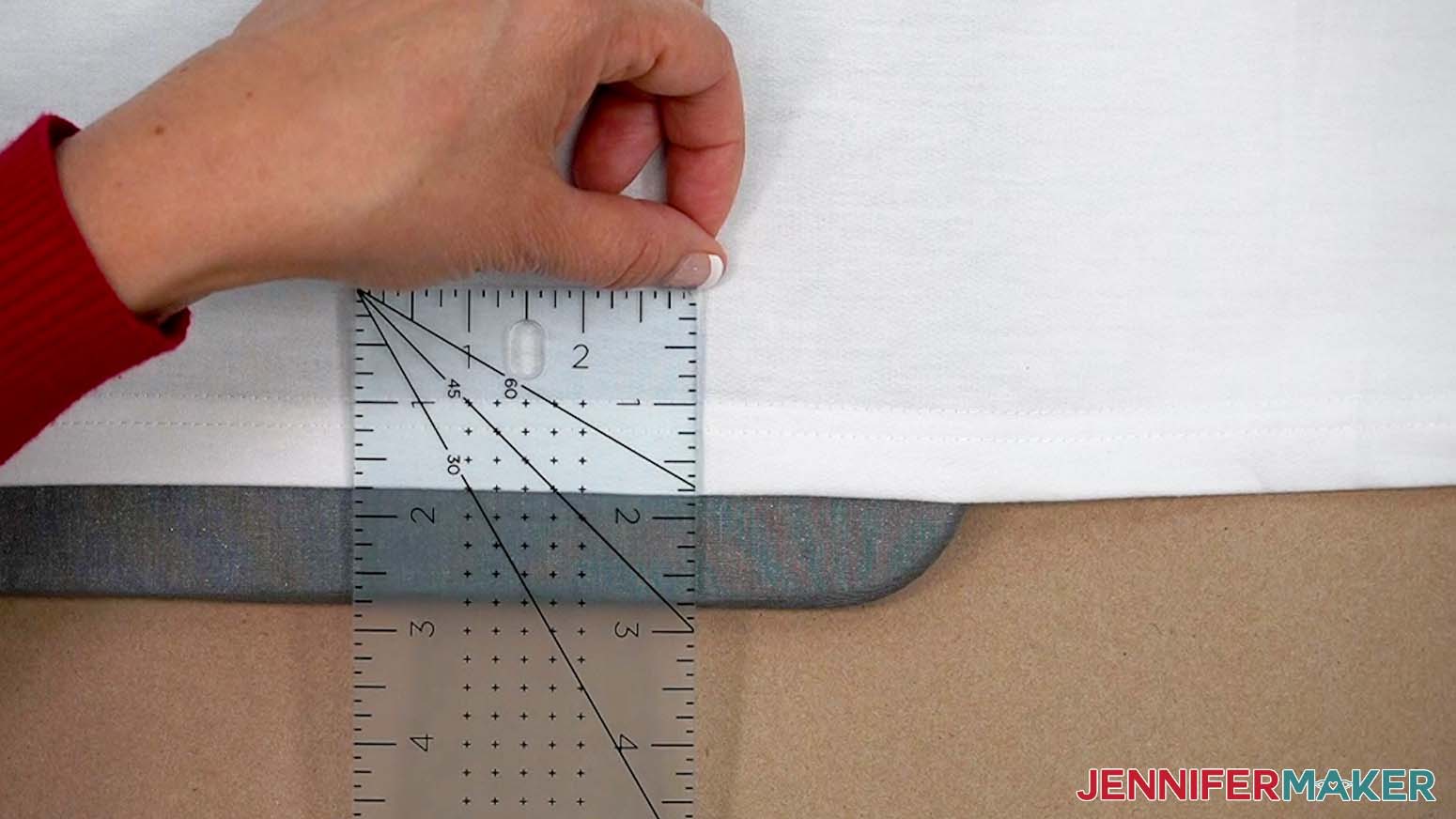 Leave at least an inch of space between the edge of the HTV design and the seam of the shirt.