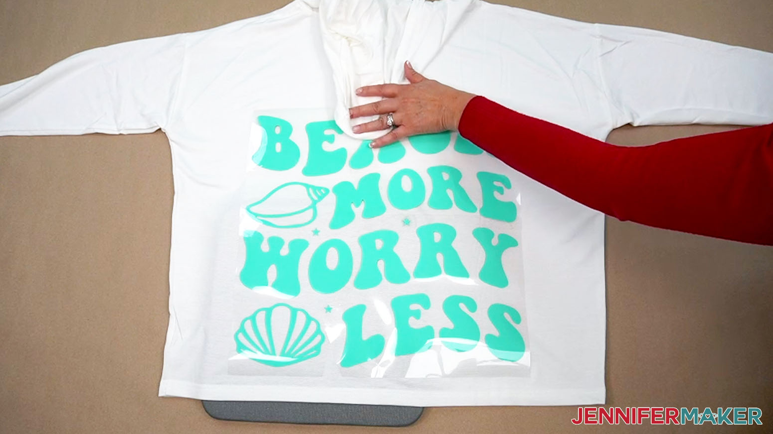 Check that the design placement is low enough to not be hidden when the hood is pulled back.