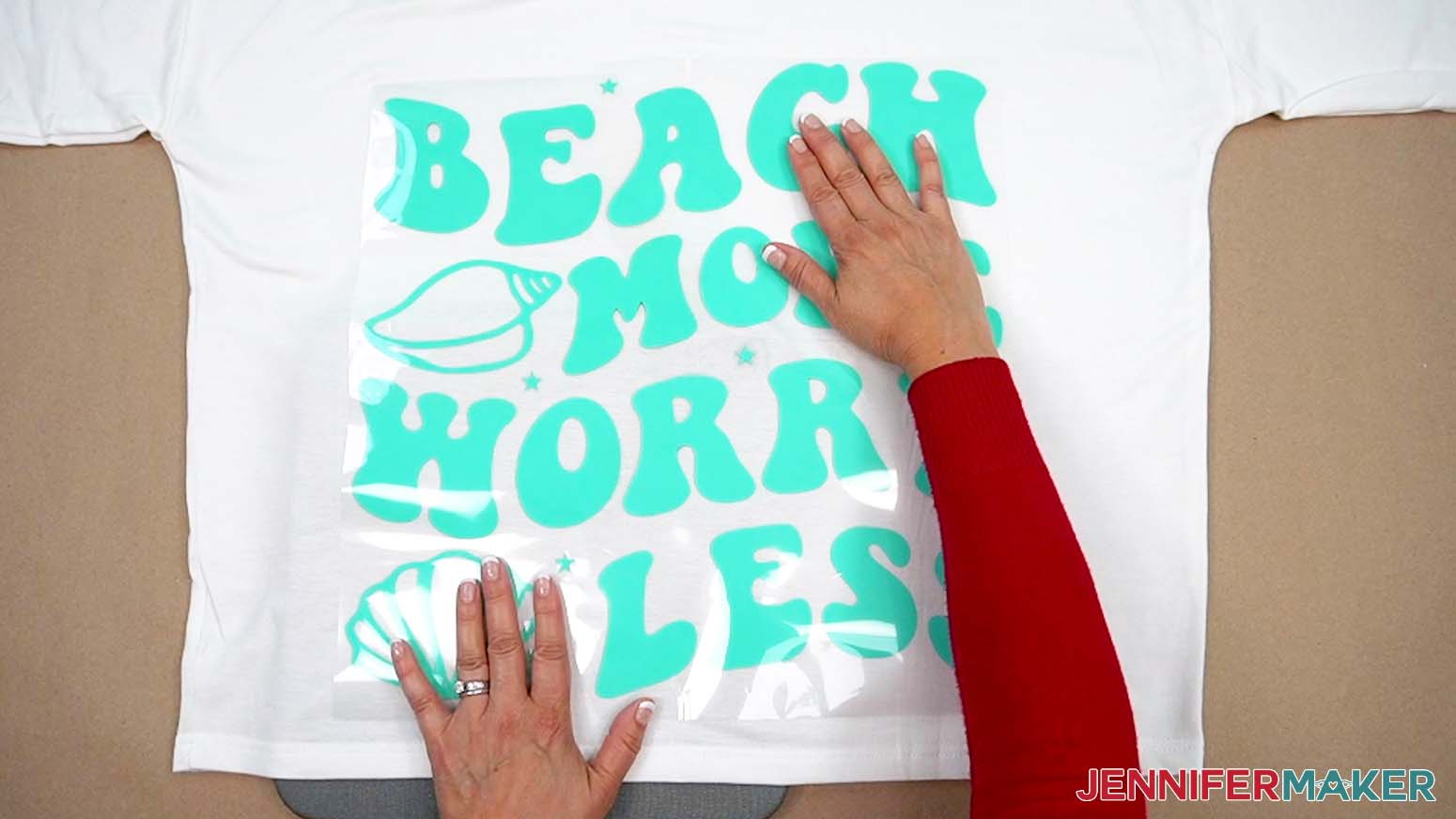 Smooth the heat transfer vinyl design into place prior to pressing.