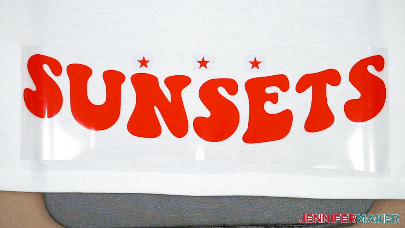 Place heat resistant tape underneath the star registration marks to prevent them from transferring to the hoodie during pressing.