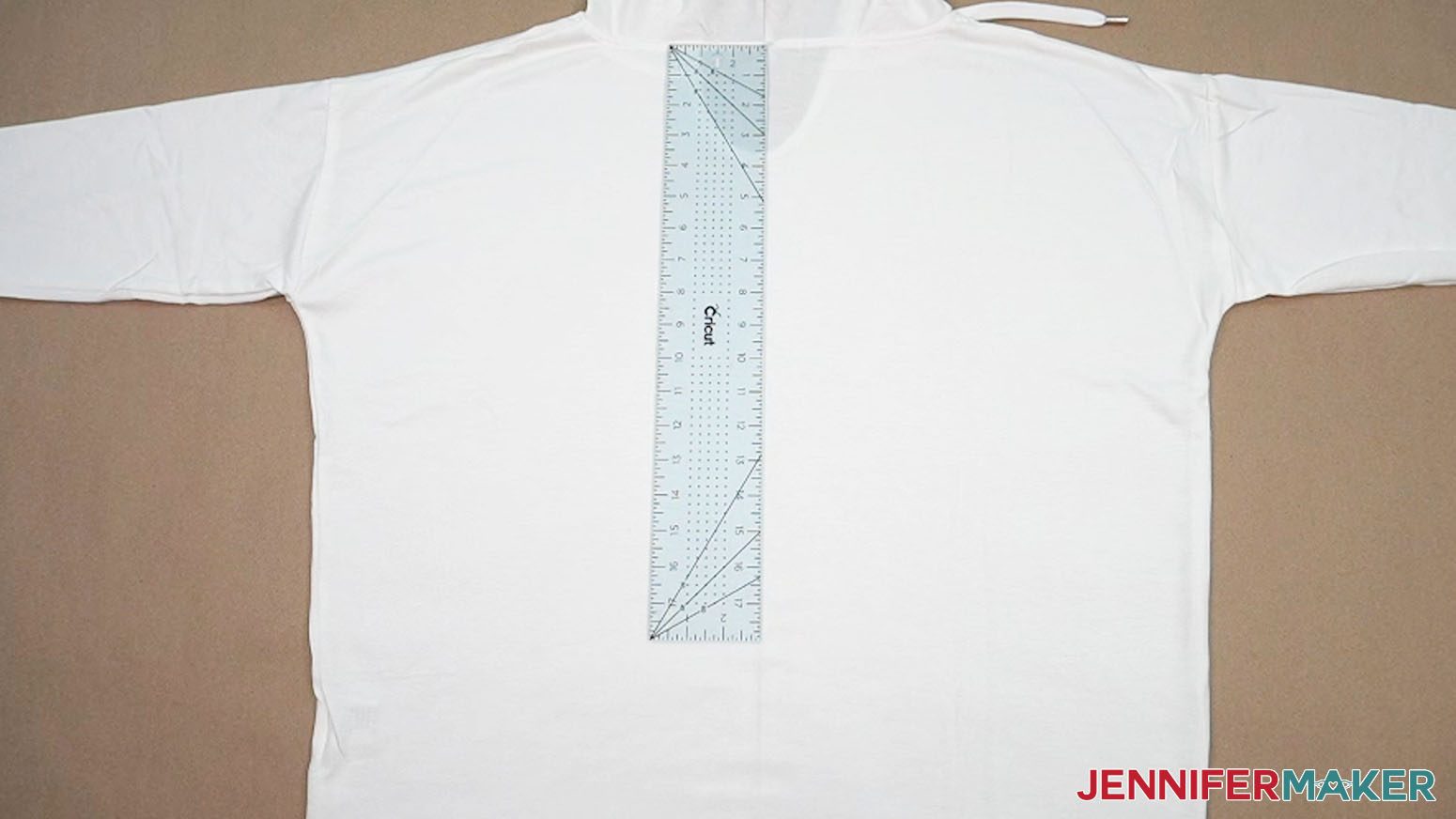 Measure down from the hoodie seam on the back to decide where to place the top of the big HTV design.