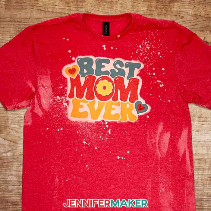 Red bleached and sublimated shirt with "Best Mom Ever" design. Learn all about bleaching shirts for sublimation with JenniferMaker's new tutorial!