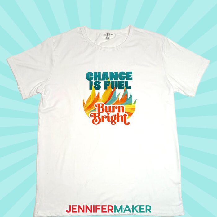 A white T-shirt with the "Change is Fuel, Burn Bright" design sublimated on the front