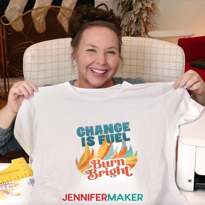 Jennifer shows off her "Change is Fuel, Burn Bright" sublimation shirt idea.