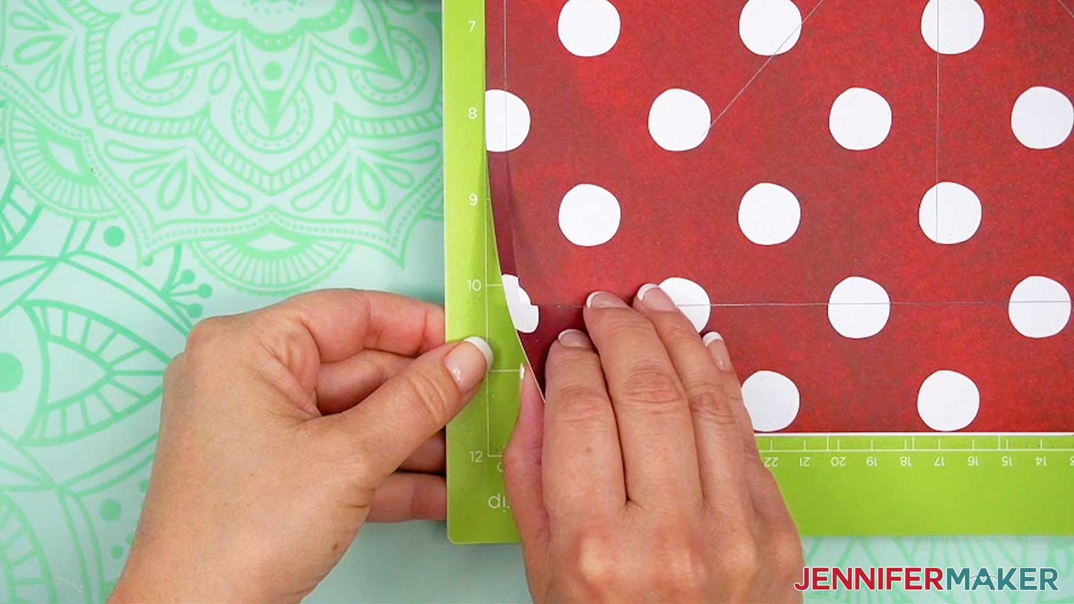 Carefully lift a corner to check the cut on the cardstock before removing the busted canvas cover pieces from the Cricut.