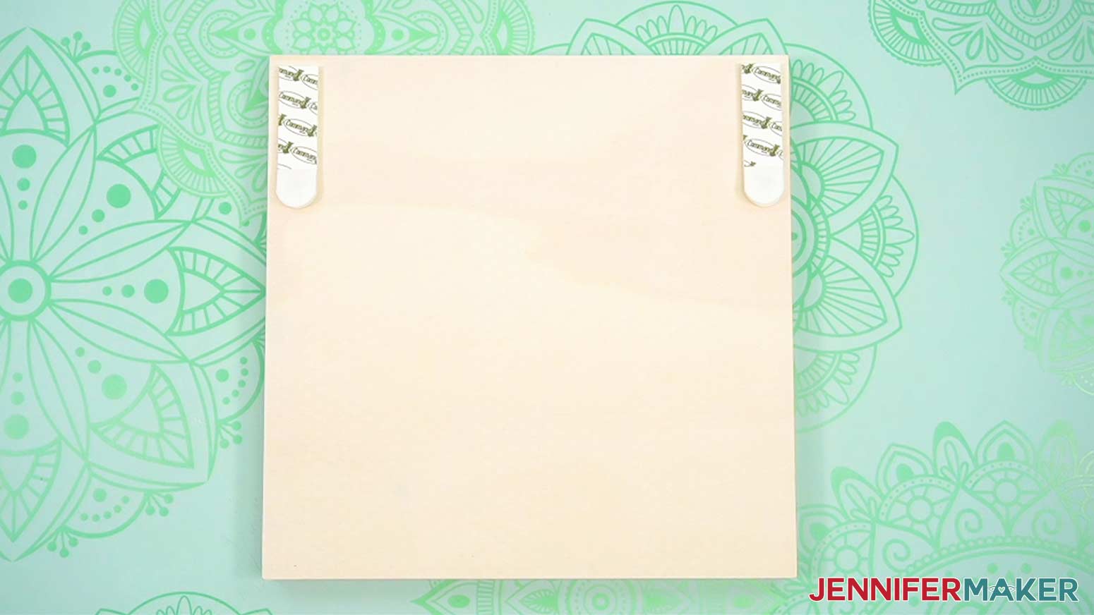 Apply hangers to the back of the wooden busted canvas frame following the directions on the hanger packaging.