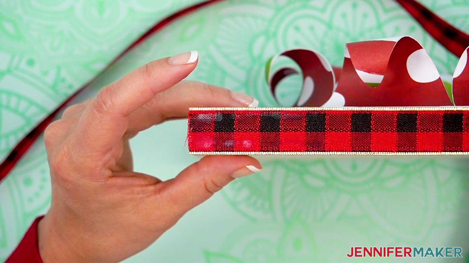 Trim the end of the ribbon to start at the edge of a bottom corner of the busted canvas.