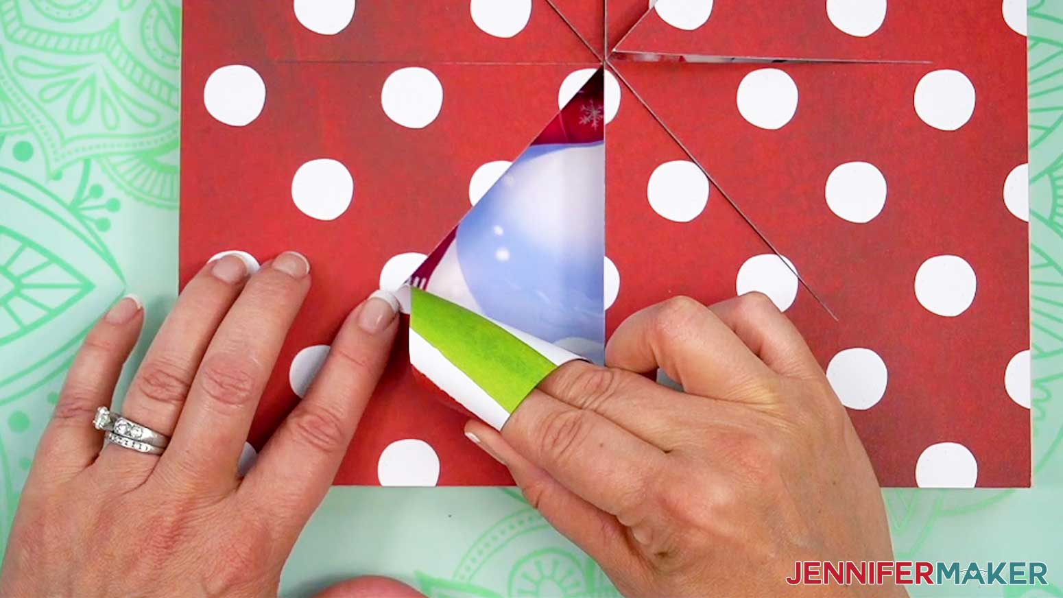 Use your fingers to roll the tip of the cut wedge shape away from the center of the busted canvas image.