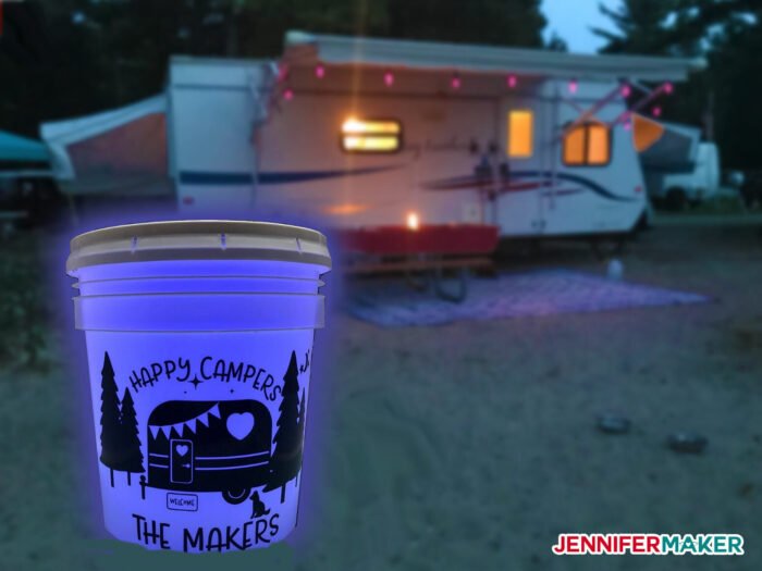 Camping Light Bucket at night with a camper