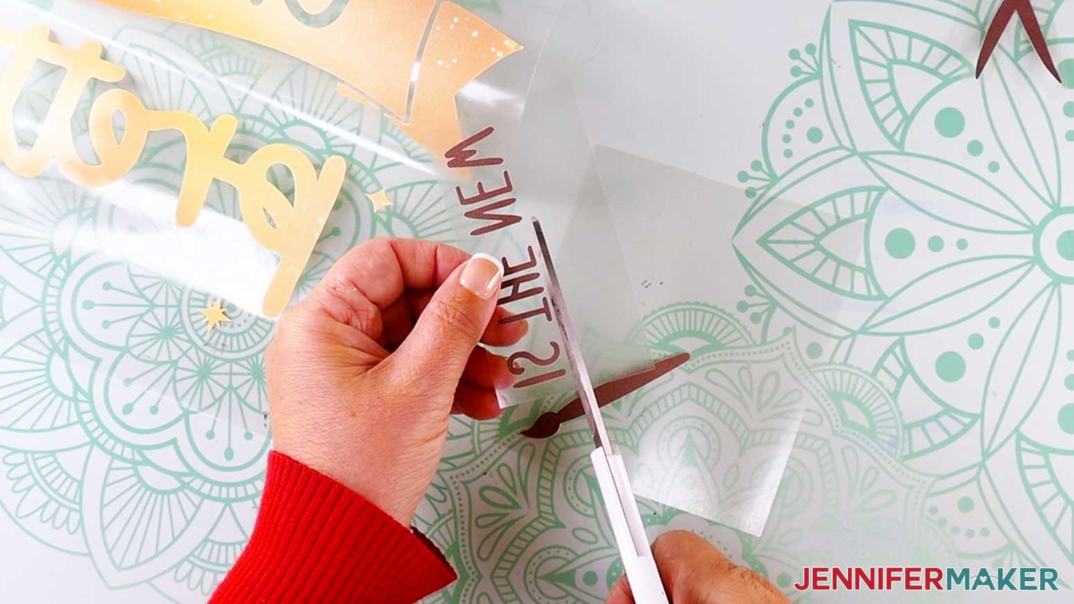 Use scissors to cut apart the design elements in the craft design.