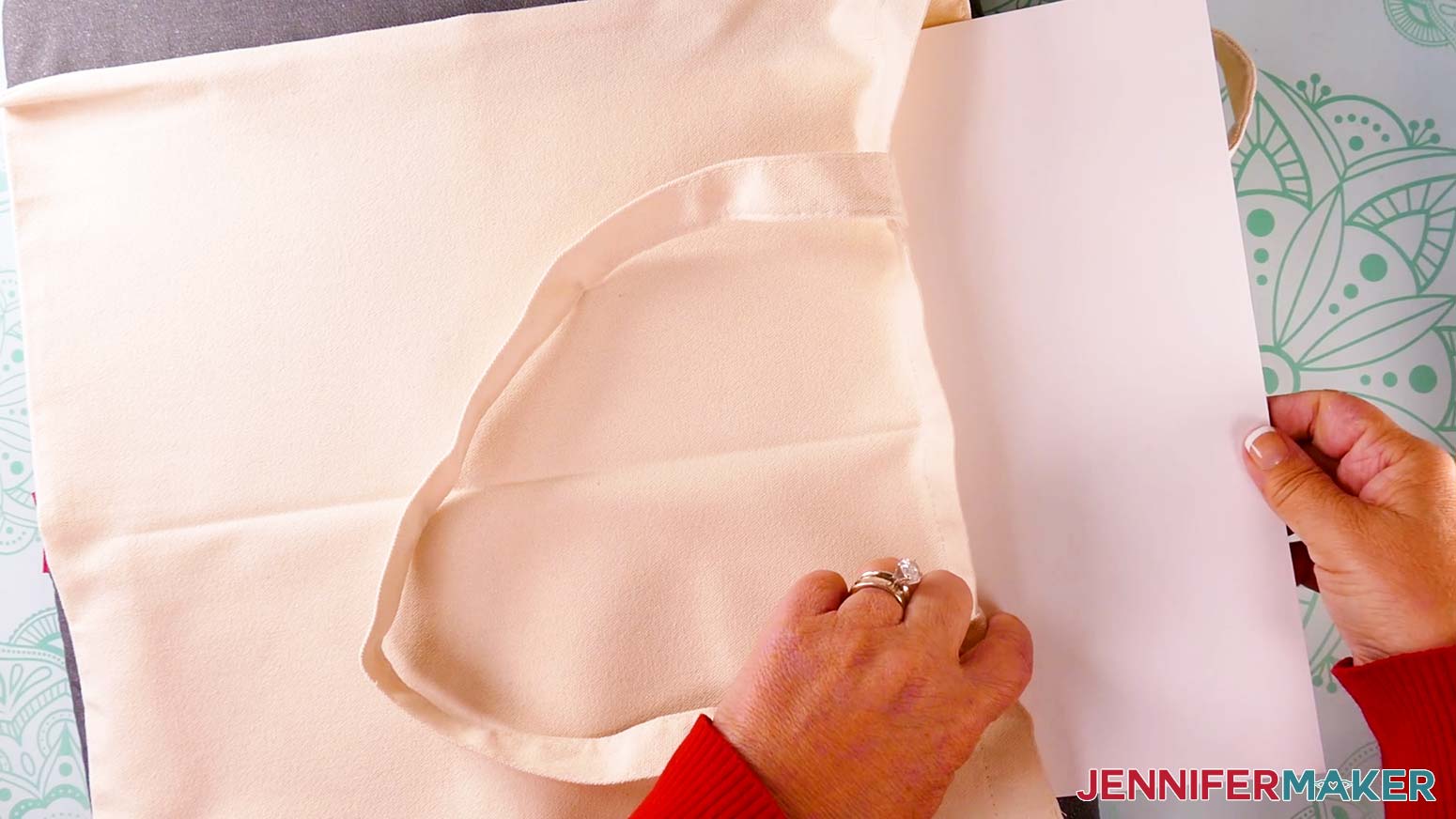 Insert a sheet of white cardstock inside the tote to prevent ink from bleeding through.