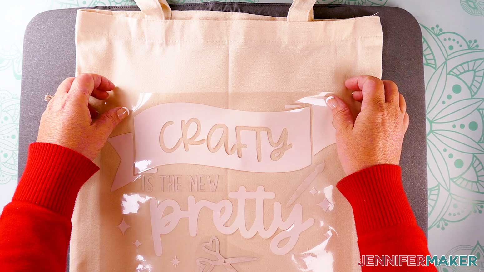 Place the infusible ink design sticky side down in the center of the tote.