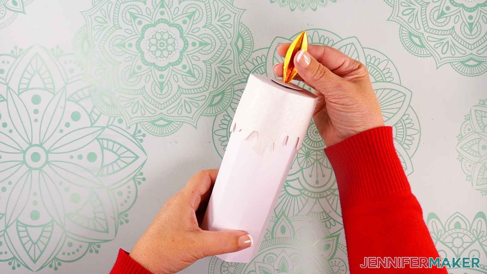 Place the magnetic flame piece on top of the lid to “light” the candle.
