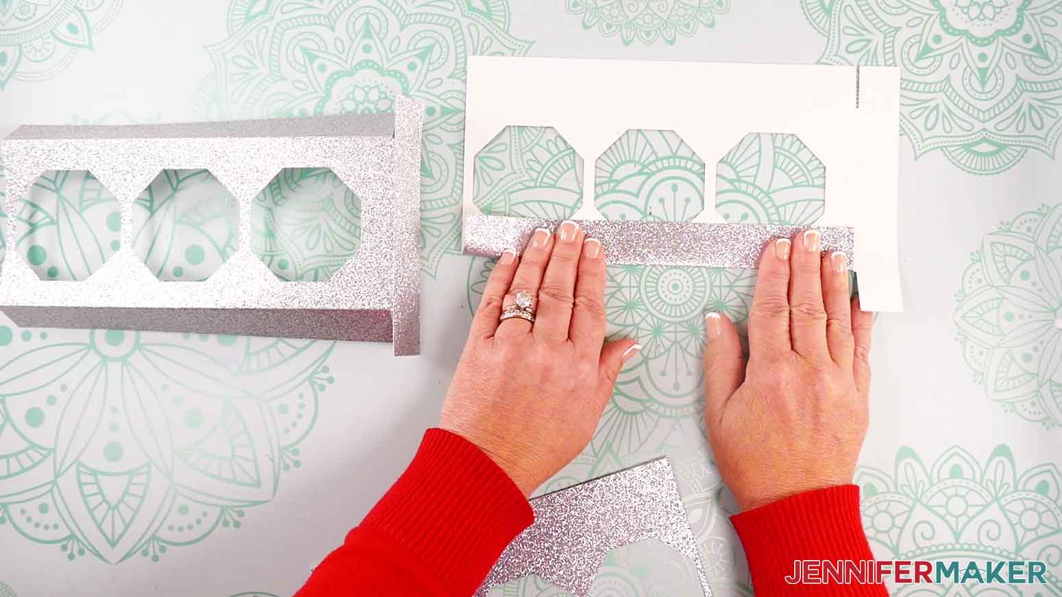 Fold the long flaps on each piece along the creases of the candle base.