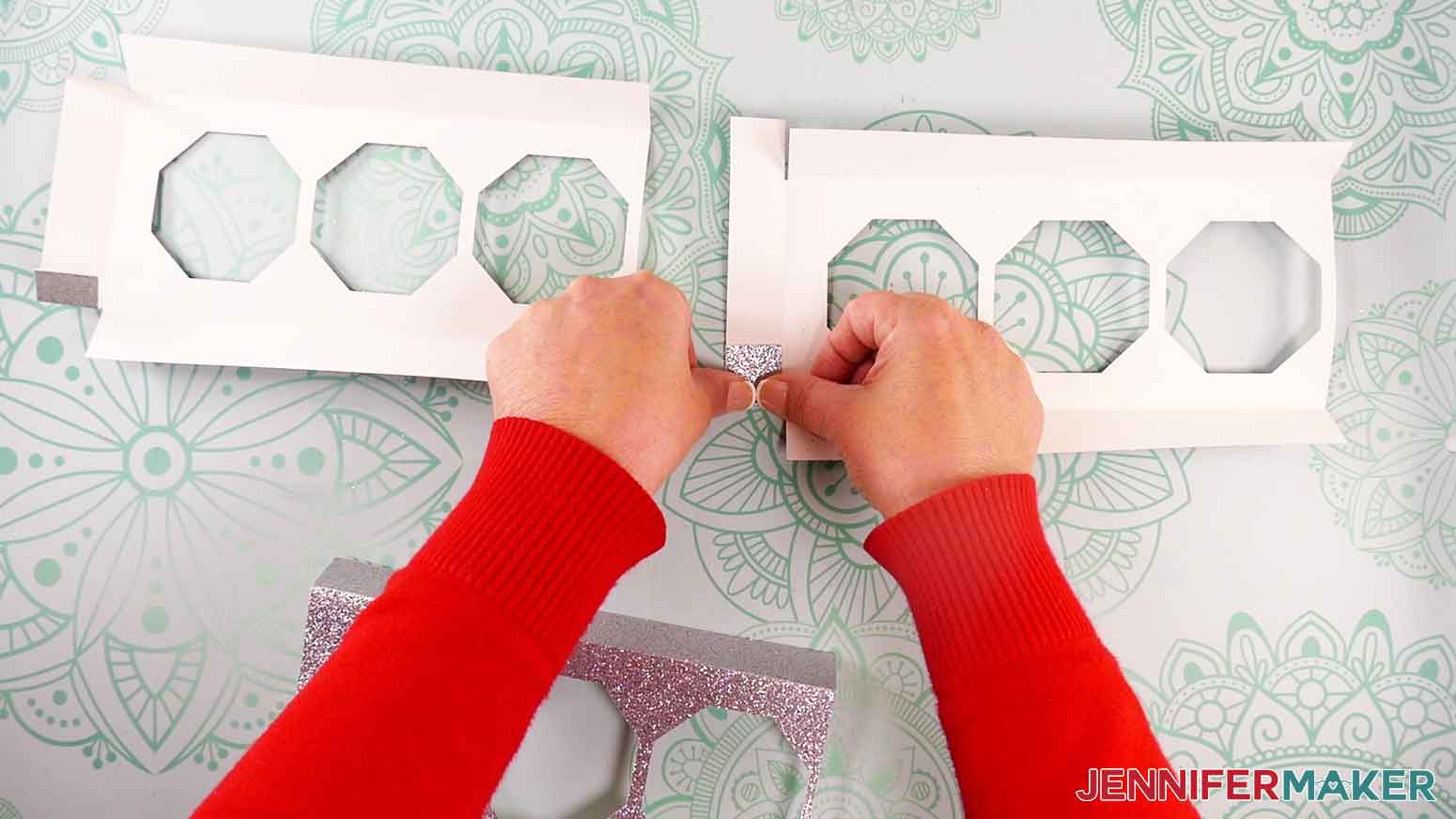 Fold the shorter tabs on the end pieces inward on the candle base.