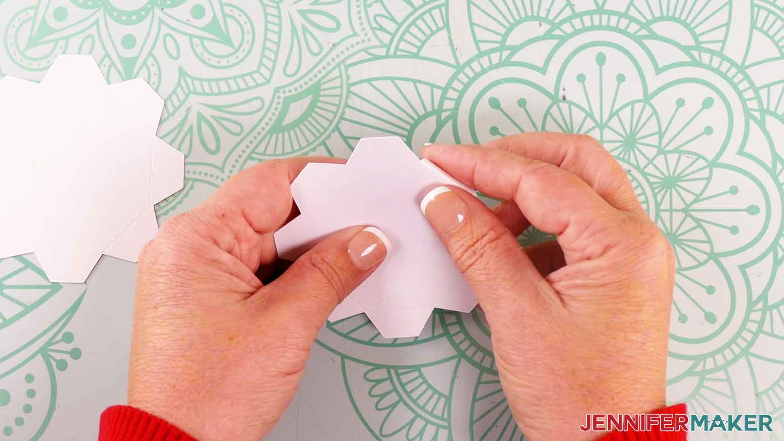 Fold tabs of the candle base.