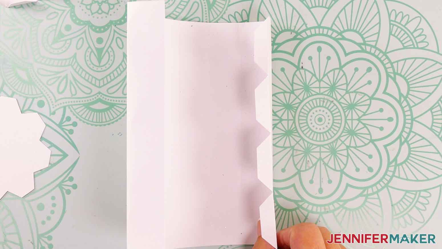 On the large rectangular candle body piece and fold inward on each of the crease lines.