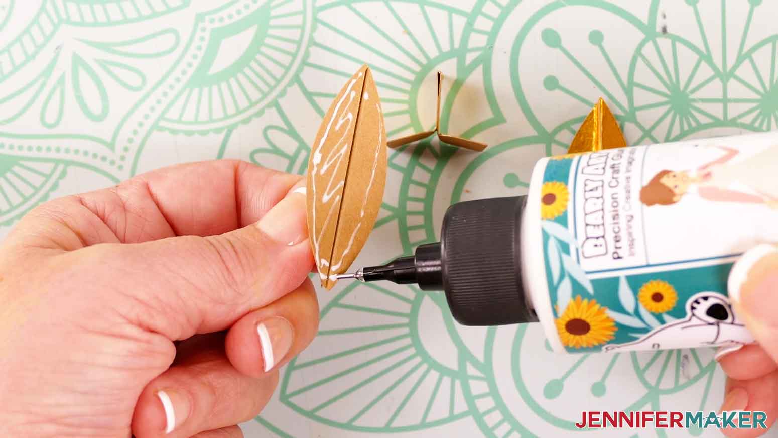 Apply glue to the back side of two assembled flame pieces.