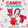 Colorful cardstock fox, hedgehog, elephant, and bunny shapes holding candies under text reading "Candy Huggers" by JenniferMaker.