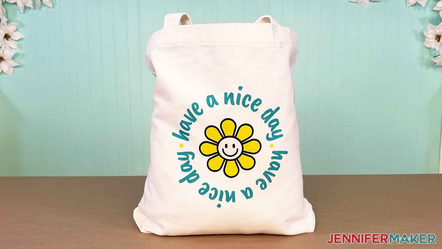 Canva gifts tote with the "have a nice day" smiley design.