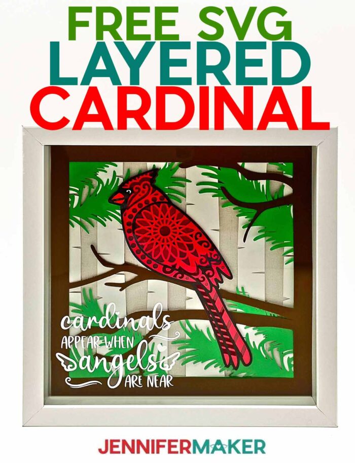 Cardstock layered cardinal SVG project in a white shadow box frame.