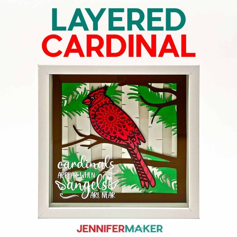 Cardinal SVG cut from cardstock layers in a white shadow box frame.