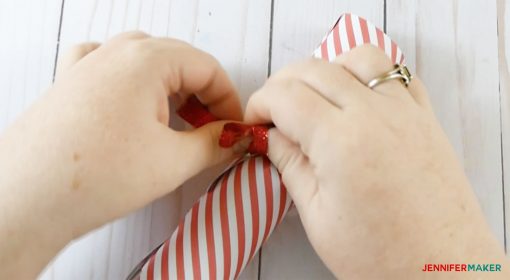 Tying the ribbon in one of the Christmas cracker / Party Popper