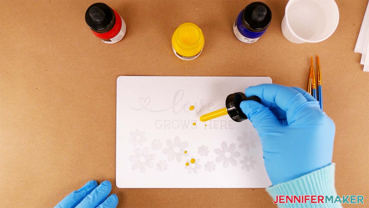 Apply a few drops of yellow acrylic ink to your color engraving design on your plaque