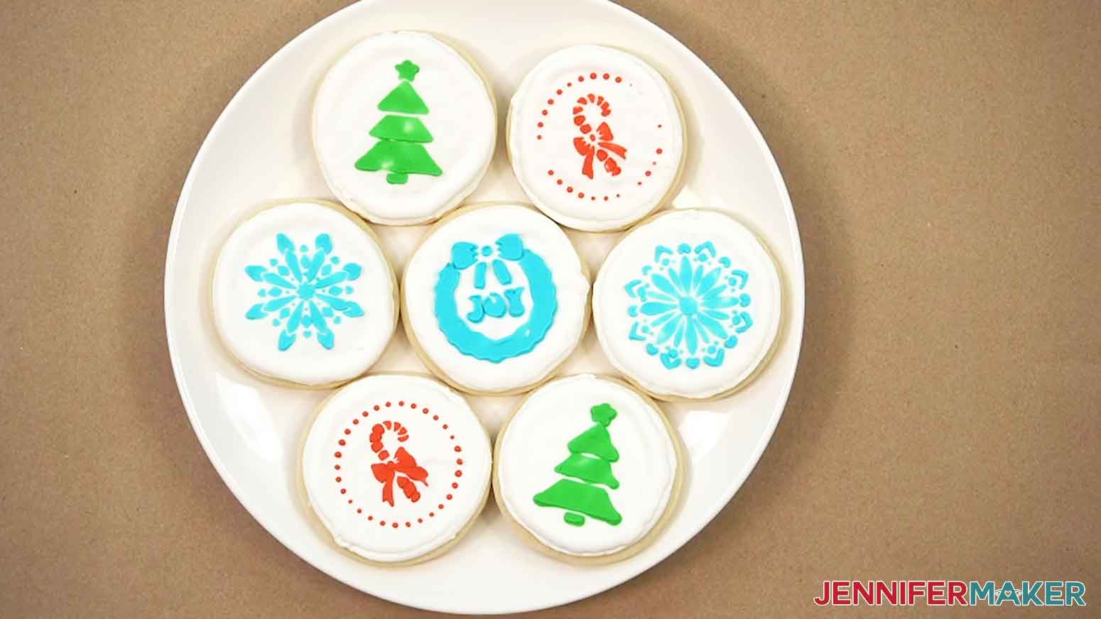 All the iced cookies are shown on white plate.