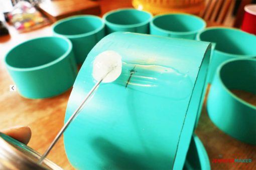 Gluing the PVC with cement to make the craft paint storage organizer