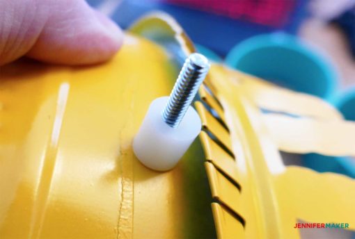 Put spacers on the end of the machine screws to make the craft paint storage organizer