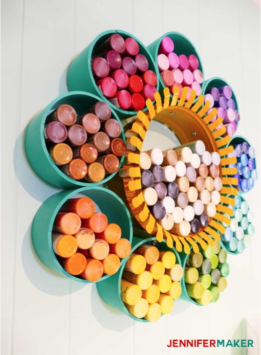 Colorful craft paint storage organizer made from PVC pipes and a duct collar -- click to see the full tutorial! #craftroom #organization #storage