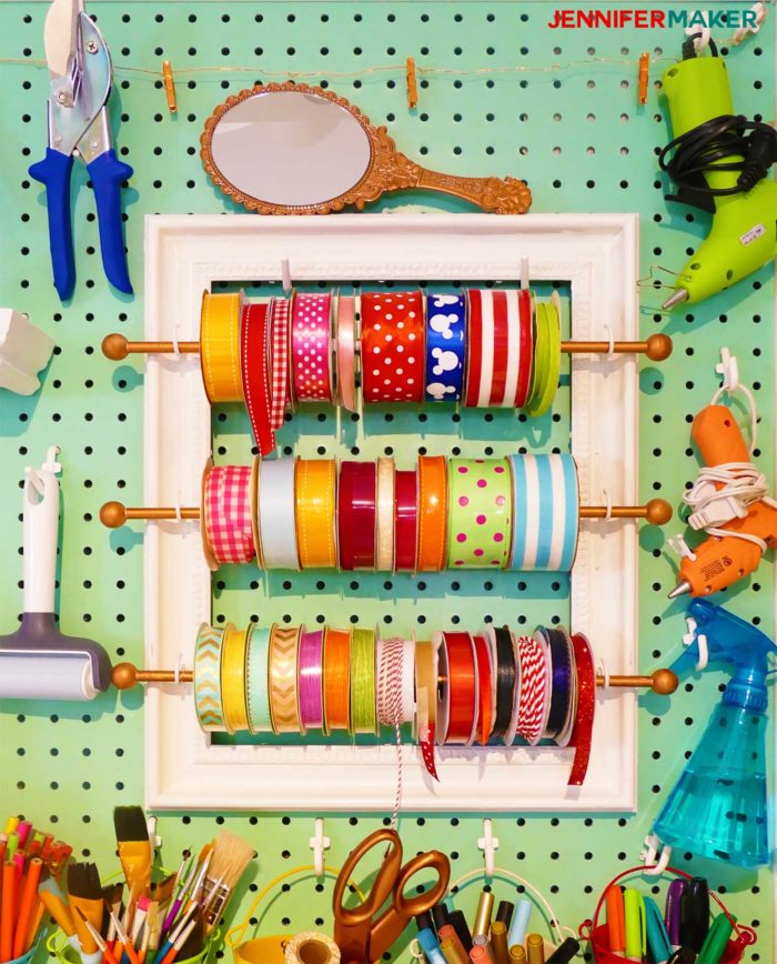 Ribbon storage frame on my giant craft room pegboard