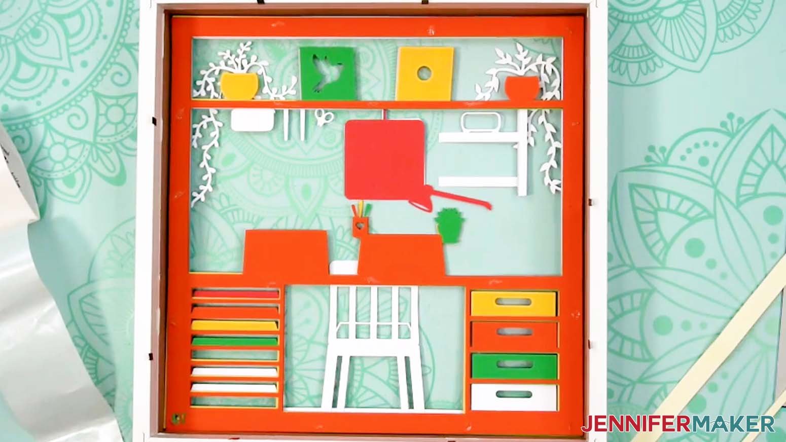 The first ten layers are face down inside the shadow box.