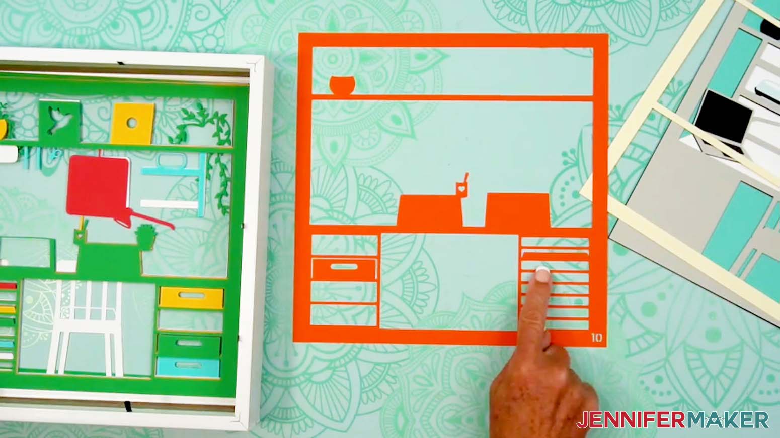 Continue placing the layers in numerical order and face down in the shadow box.