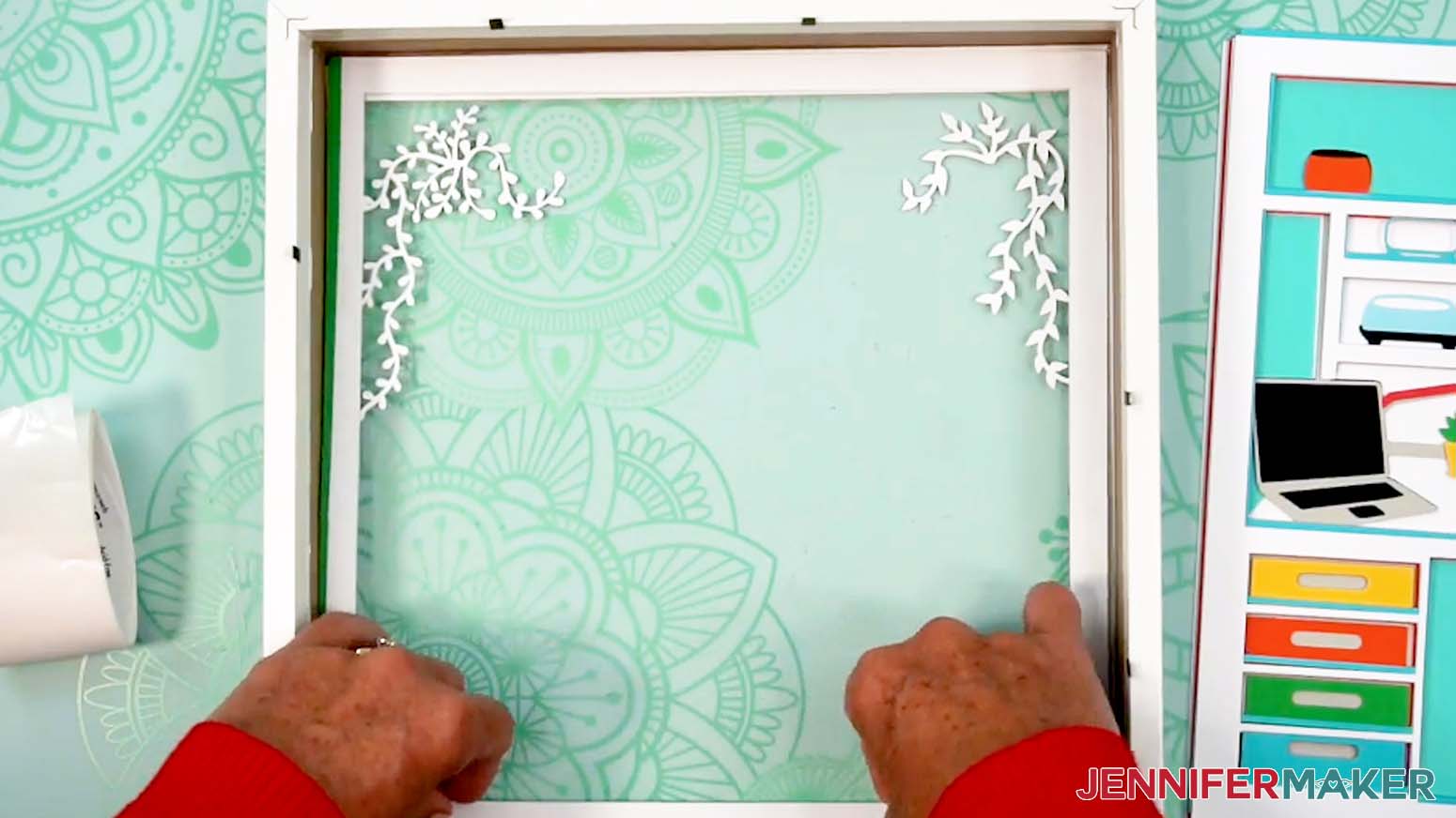 Place the second green layer with vinyl backing face down in the shadow box.