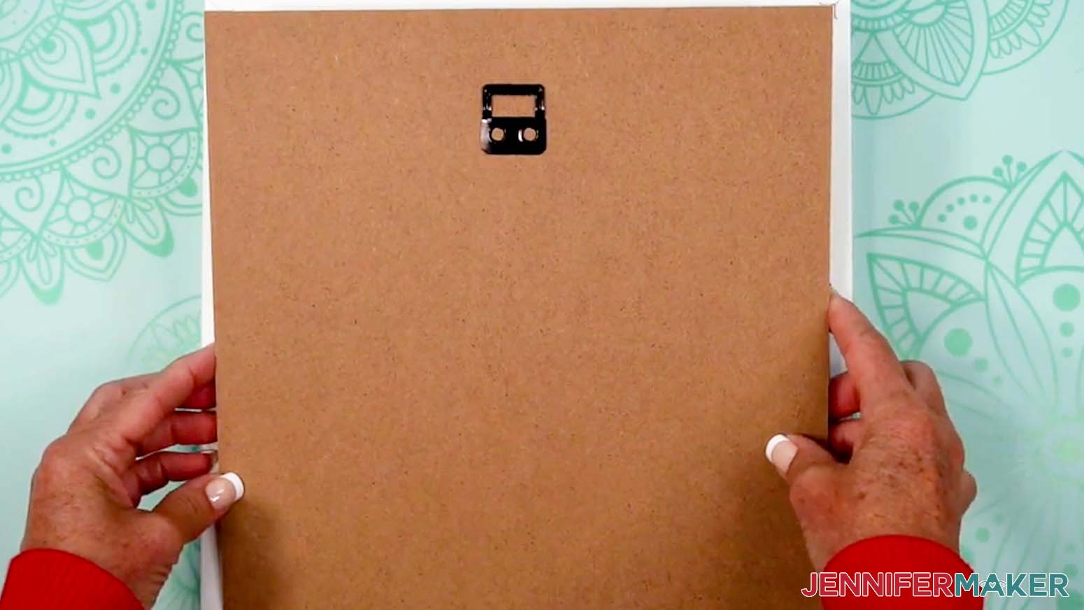 Place the shadow box backing in place and secure it with the tabs.