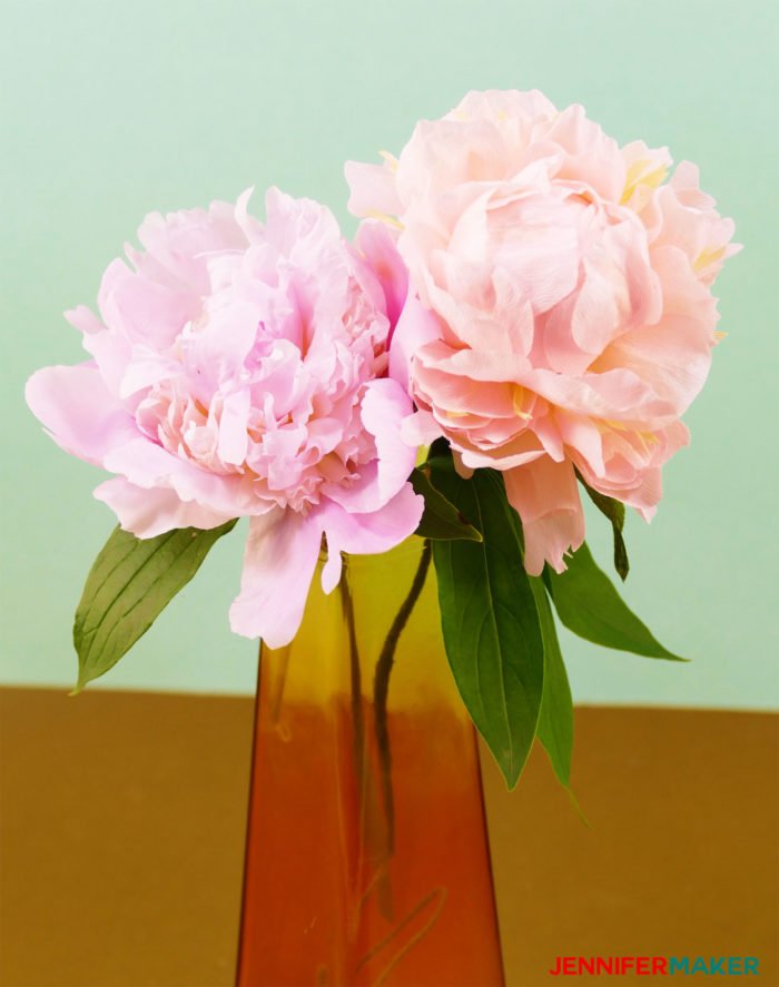 Two peonies in a vase -- one is real, one is a faux crepe paper flower