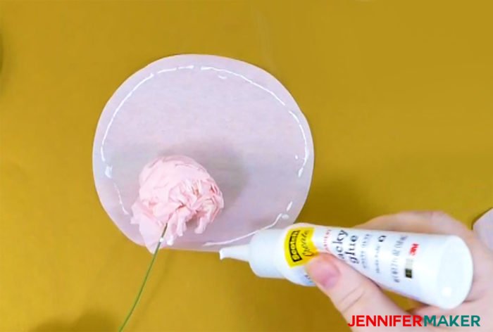 Glue the crepe paper circle around the ball and wire to make crepe paper peony flowers