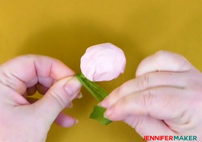 Wrap floral tape around the crepe paper bud to make crepe paper peony flowers