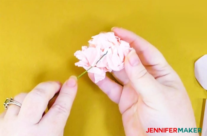 Glue floral wire into the center of a crepe paper ball to to make crepe paper peony flowers