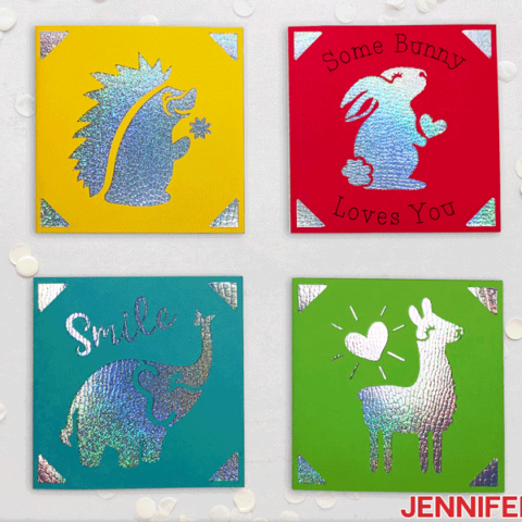 Square Cricut cards in yellow, red, blue, and green with animal designs in metallic cardstock