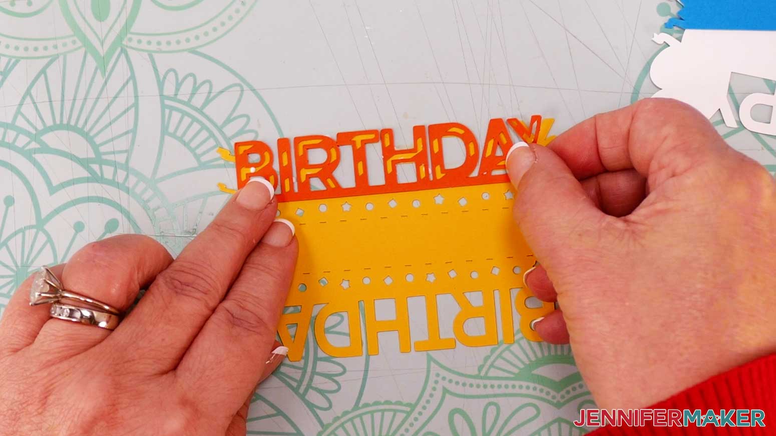 Glue the orange "birthday" piece on top of the yellow "birthday" base to make the cardboard jumping box "happy birthday" sentiment