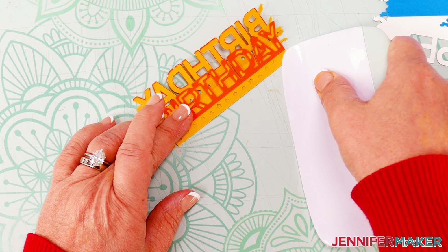 Use a scraper tool to crease along the folded edge of the cardboard jumping box "birthday" sentiment
