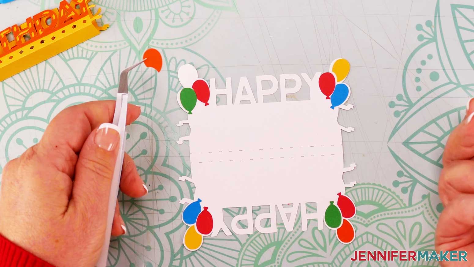 Place the twelve balloon pieces in their correct positions for the birthday themed cardboard jumping box and use tweezers to help glue them in place one by one