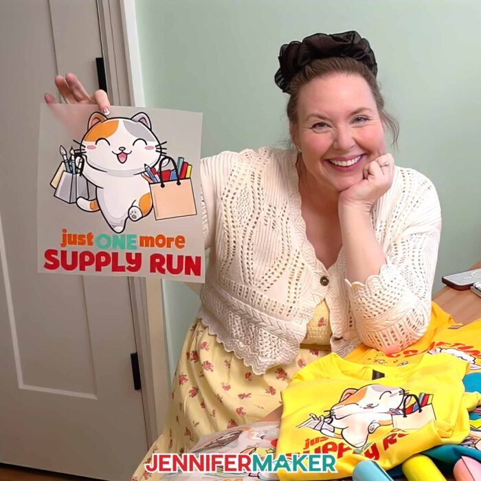 Jennifer Maker shows off one of the Cricut DTF Transfers she ordered from Cricut Design Space, featuring a cute crafting cat design